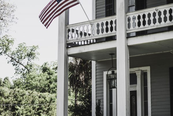 Two Story Colonial House with American Flag
