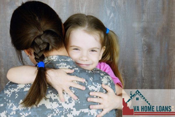 Little girl hugging veteran lady with a uniform on against a wooden wall